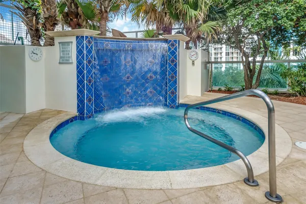 a view of a swimming pool with a lounge chair