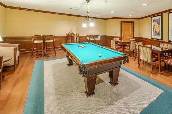 a living room with couches and a flat screen tv
