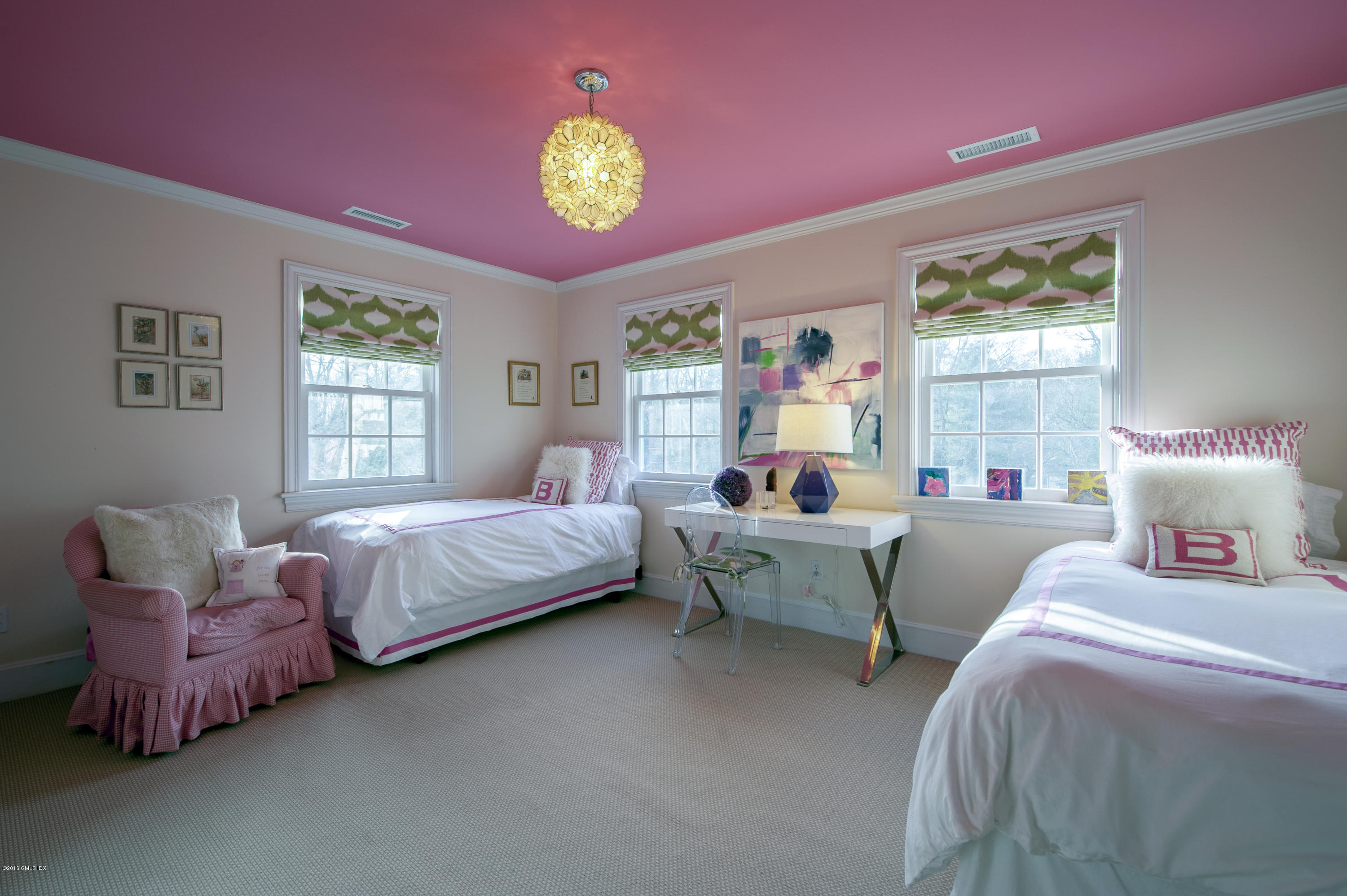 175 Stanwich Road Greenwich, CT 06830 - Photo 11 of 21 a spacious bedroom with two beds and a chandelier