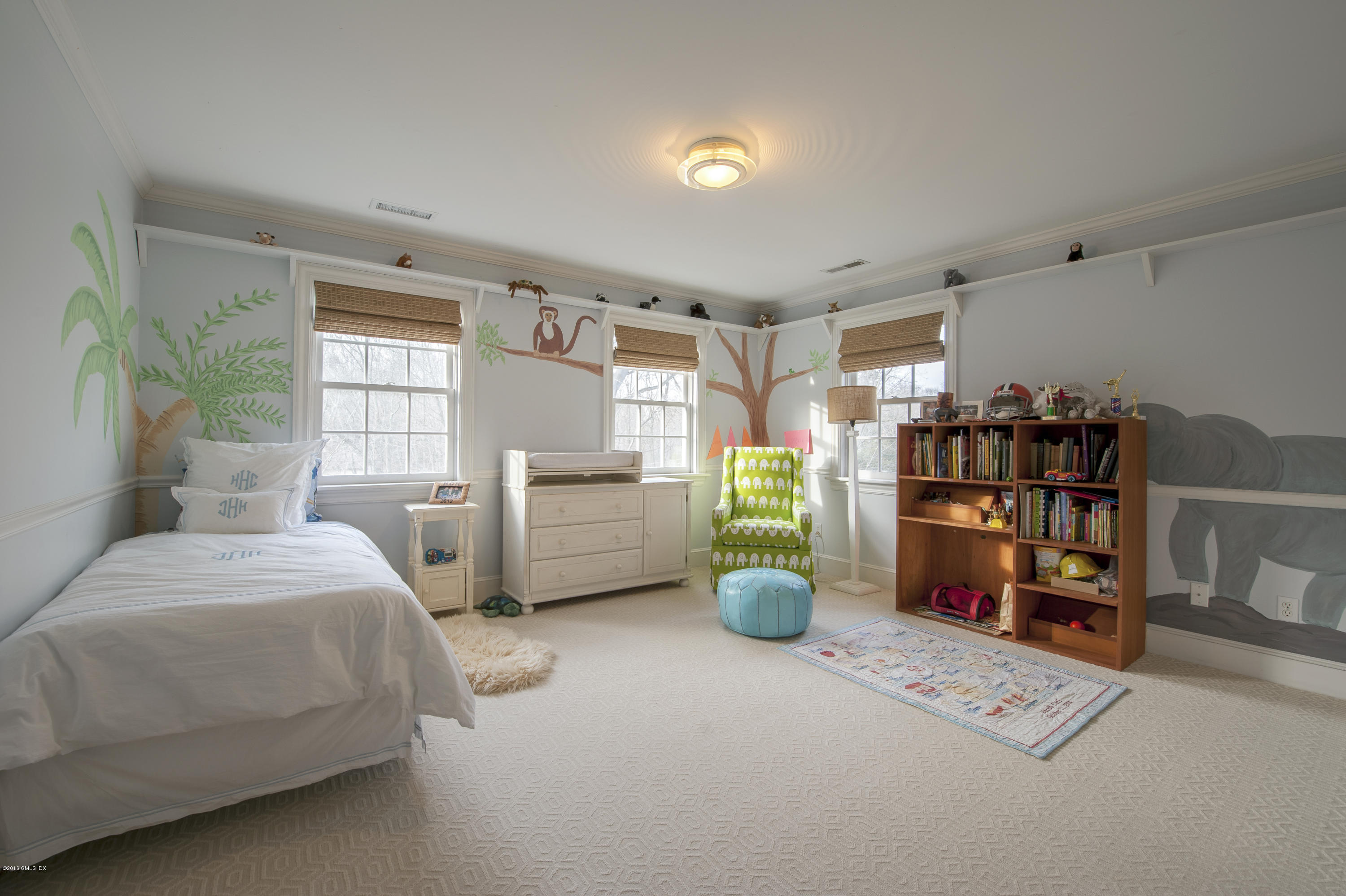 175 Stanwich Road Greenwich, CT 06830 - Photo 12 of 21 a bed room with a bed and a book shelf