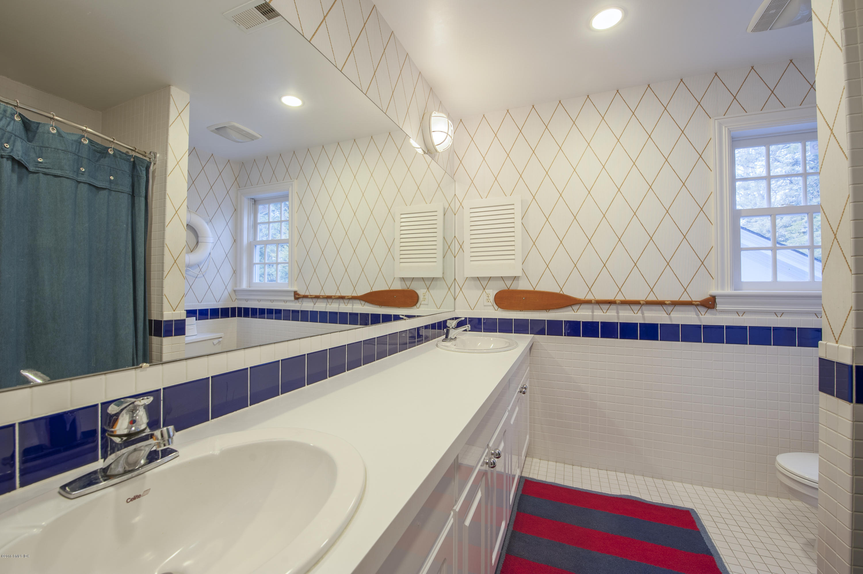 175 Stanwich Road Greenwich, CT 06830 - Photo 14 of 21 a bathroom with a tub a sink and a large mirror