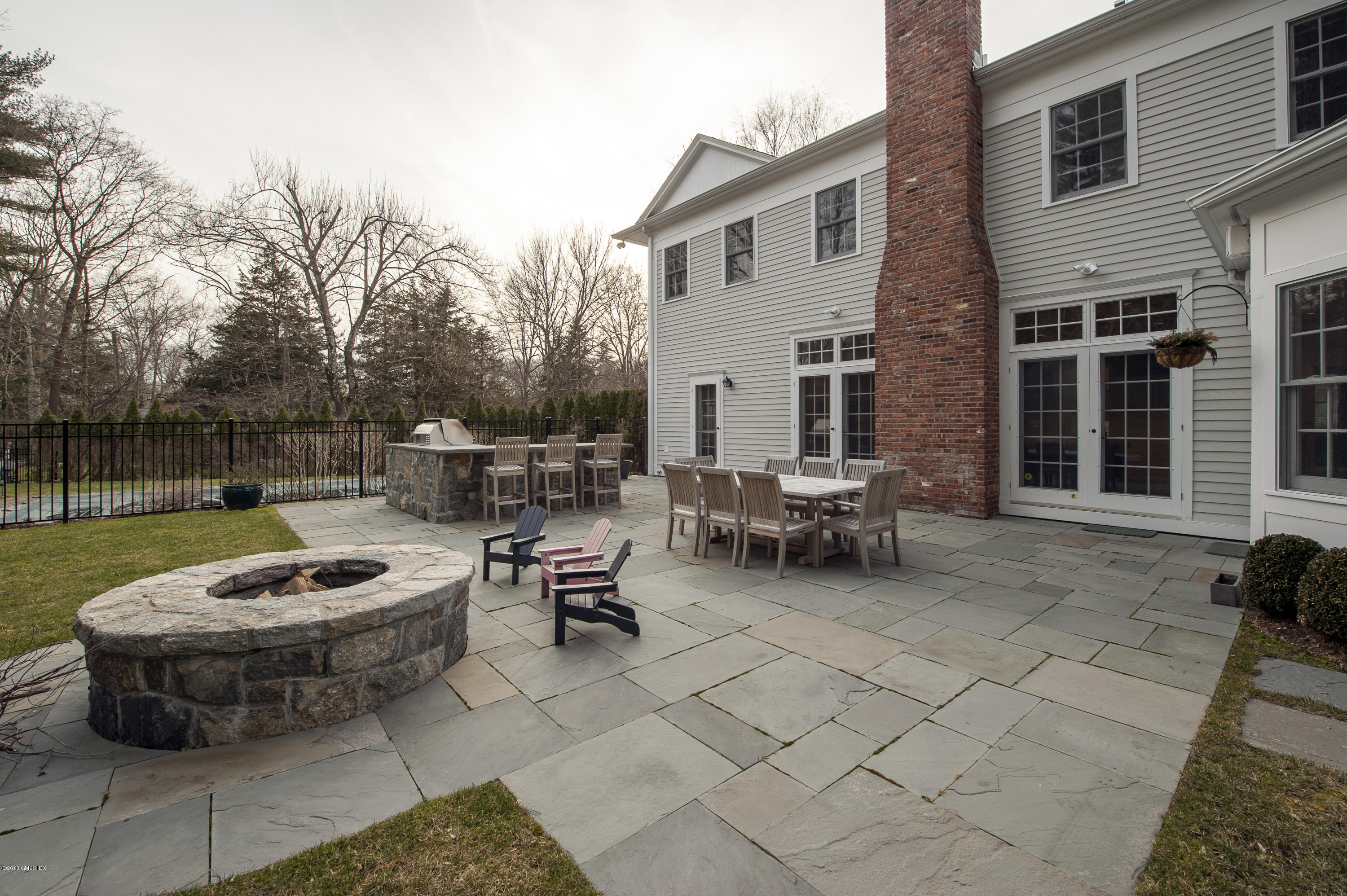 175 Stanwich Road Greenwich, CT 06830 - Photo 17 of 21 a view of a backyard with sitting area and fire pit