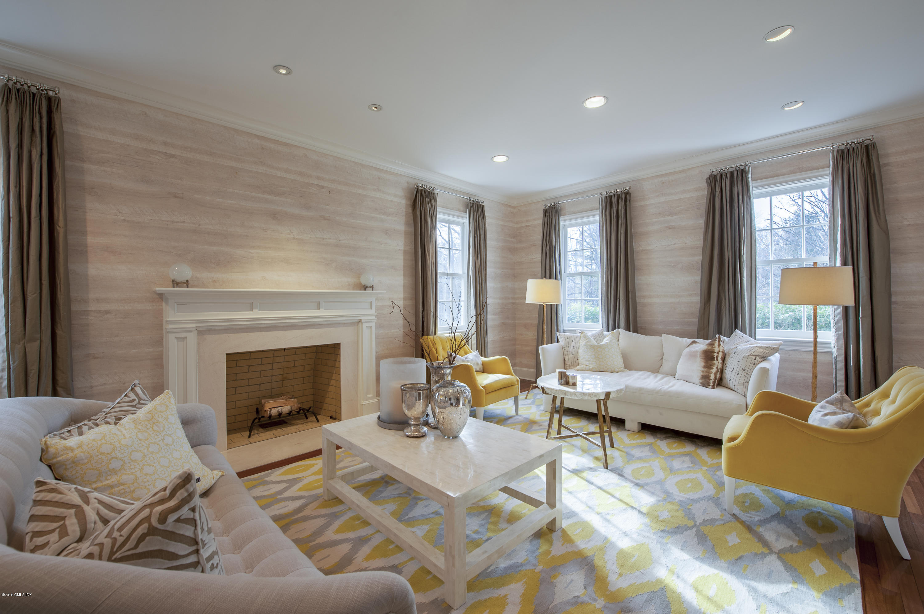 175 Stanwich Road Greenwich, CT 06830 - Photo 2 of 21 a living room with furniture and a fireplace