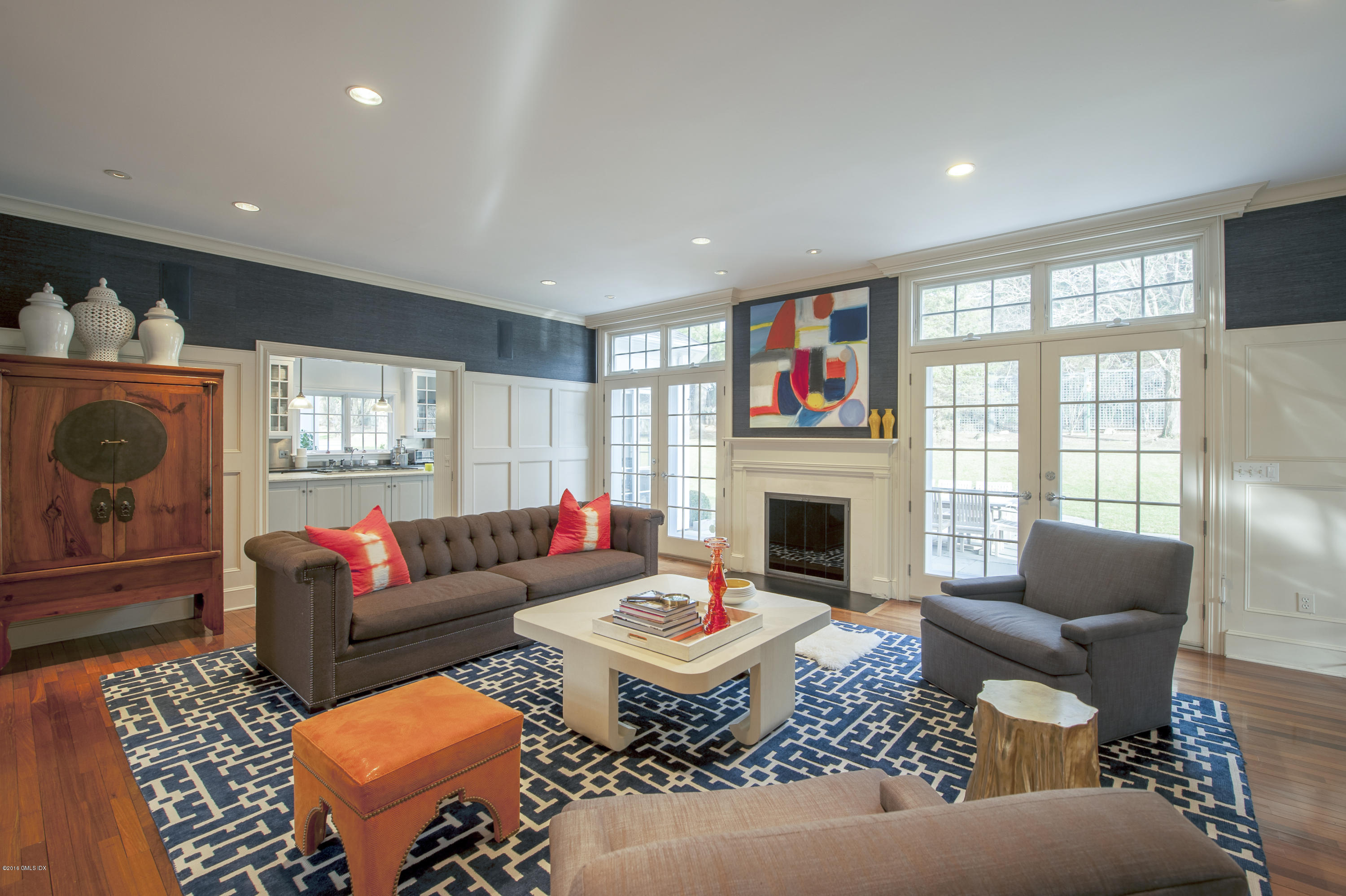 175 Stanwich Road Greenwich, CT 06830 - Photo 5 of 21 a living room with furniture a rug and a fireplace