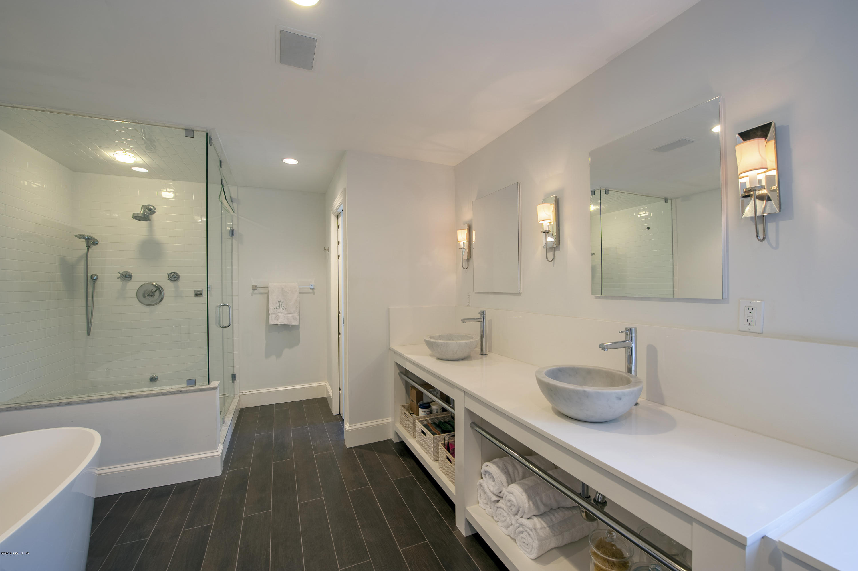 175 Stanwich Road Greenwich, CT 06830 - Photo 10 of 21 a bathroom with a double vanity sink mirror double and shower