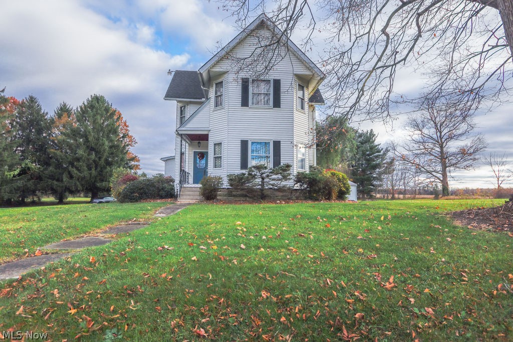 51883 Telegraph Road Amherst, OH 44001 - Photo 36 of 49 View of front of property featuring a front lawn