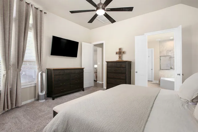 a bedroom with a bed and a fireplace