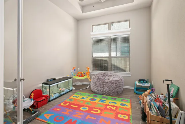 a living room with furniture a rug and a chandelier