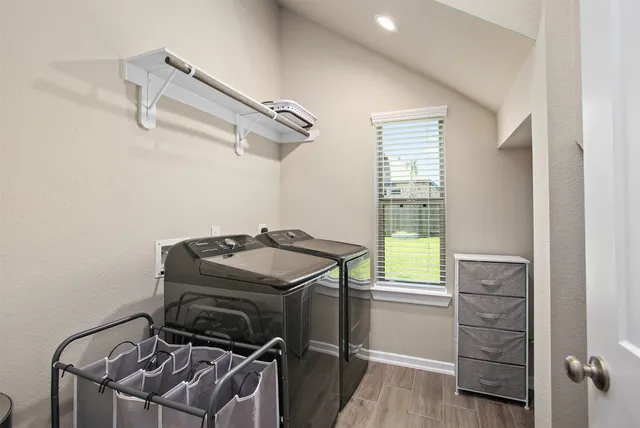 a view of a storage & utility room with a window