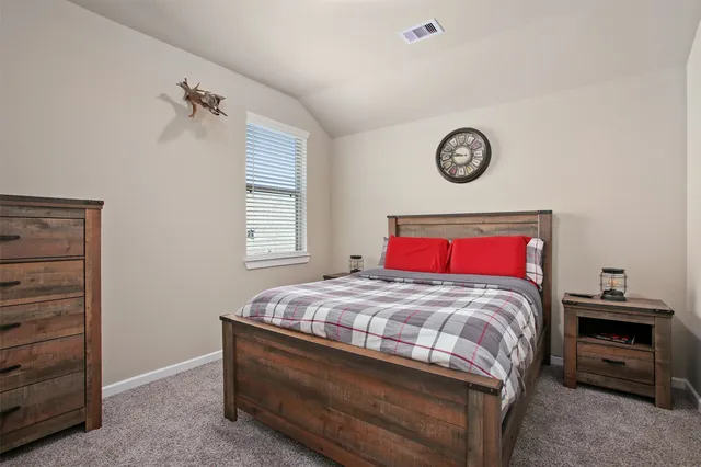 a bedroom with a bed and a closet