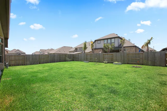 a view of a back yard with an outdoor space