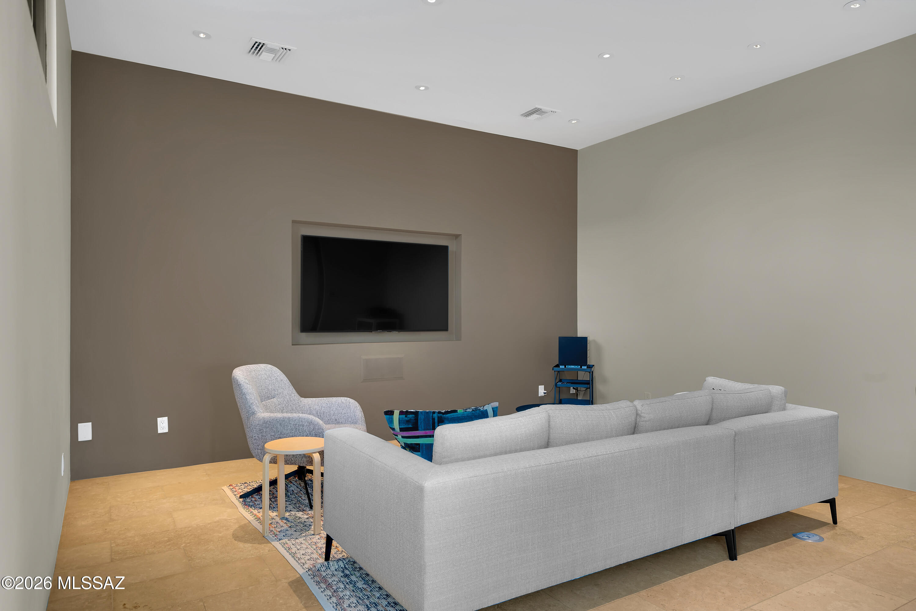 9971 North Silverbell Road Marana, AZ 85653 - Photo 18 of 34 a living room with furniture and a flat screen tv