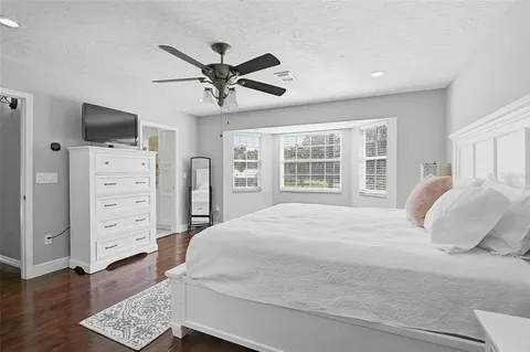 a bathroom with a granite countertop sink double and mirror