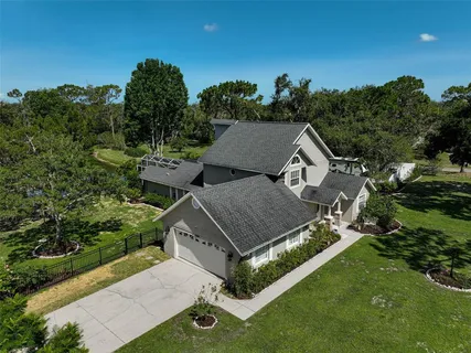 an aerial view of a house having yard
