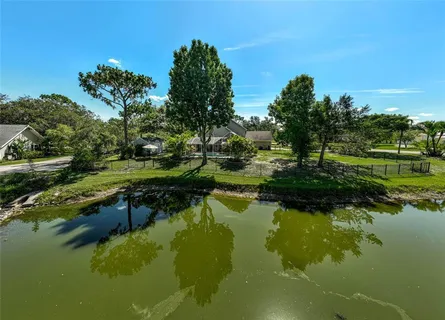 a front view of house with yard and trees
