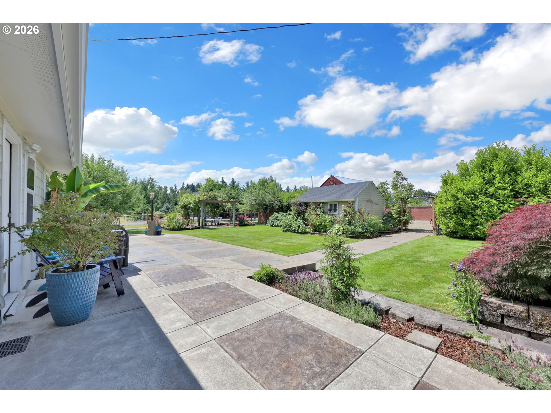 90440 Goodman Road Junction City, OR 97448 - Photo 35 of 48 a view of a patio with a table and chairs