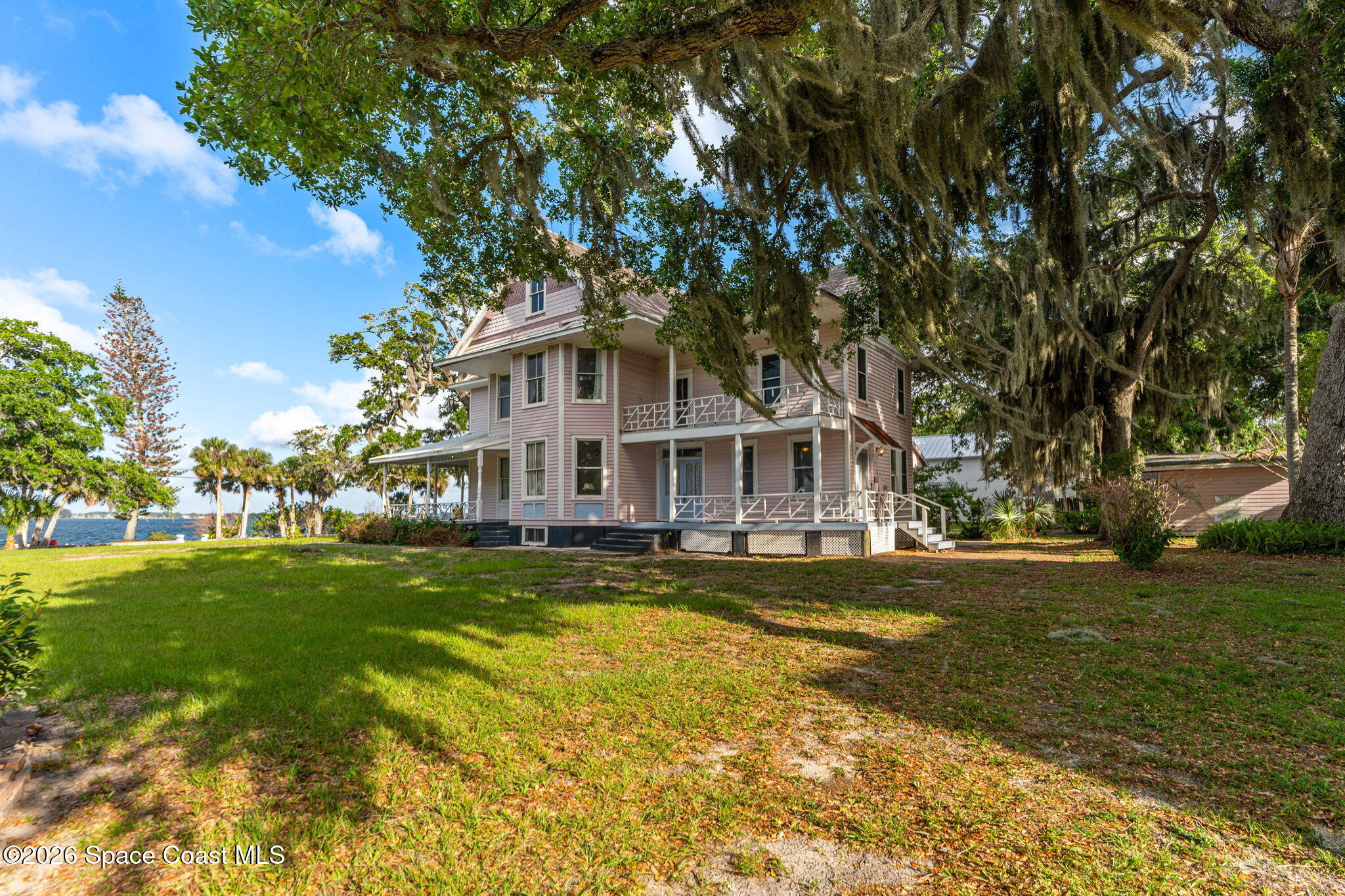 1101 Rockledge Drive Rockledge, FL 32955 - Photo 68 of 76 a view of a house with a big yard and large trees
