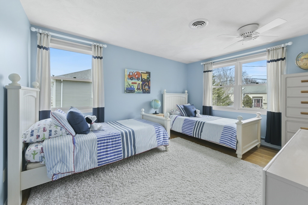 4 Coach Lane Dedham, MA 02026 - Photo 17 of 32 a bedroom with bed and window