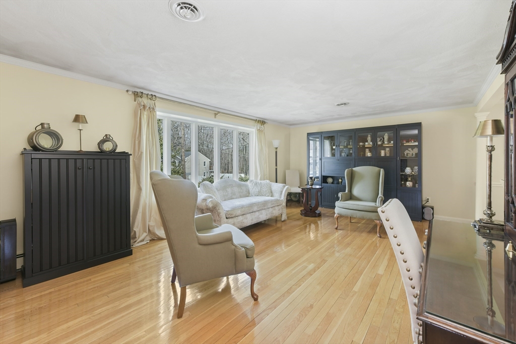 4 Coach Lane Dedham, MA 02026 - Photo 2 of 32 a living room with furniture and a window
