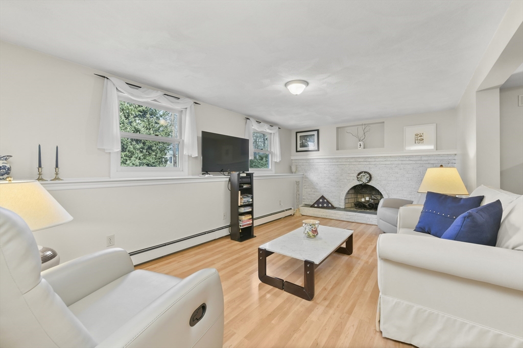 4 Coach Lane Dedham, MA 02026 - Photo 21 of 32 a living room with furniture and a flat screen tv