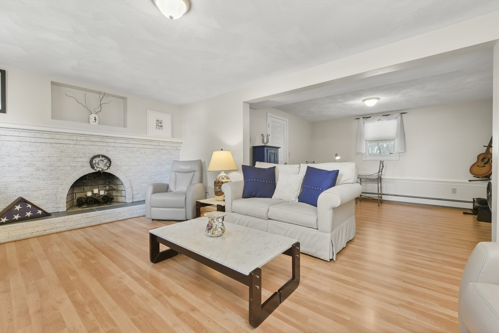 4 Coach Lane Dedham, MA 02026 - Photo 22 of 32 a living room with furniture and a wooden floor