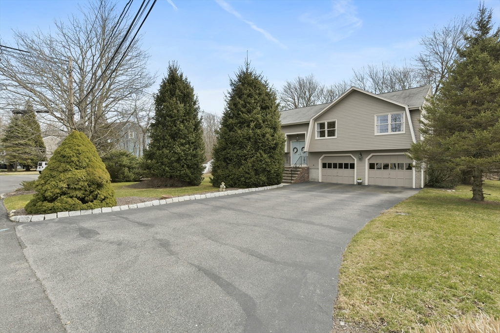 4 Coach Lane Dedham, MA 02026 - Photo 24 of 32 a view of a house with a yard