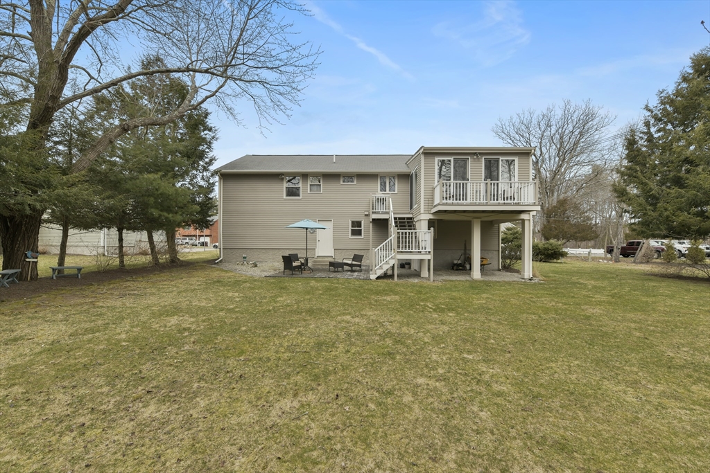 4 Coach Lane Dedham, MA 02026 - Photo 29 of 32 a view of a house with a yard