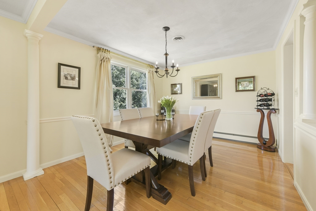 4 Coach Lane Dedham, MA 02026 - Photo 3 of 32 a view of a dining room with furniture window and wooden floor