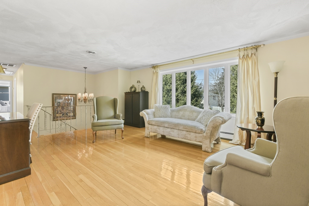 4 Coach Lane Dedham, MA 02026 - Photo 10 of 32 a living room with furniture and large windows