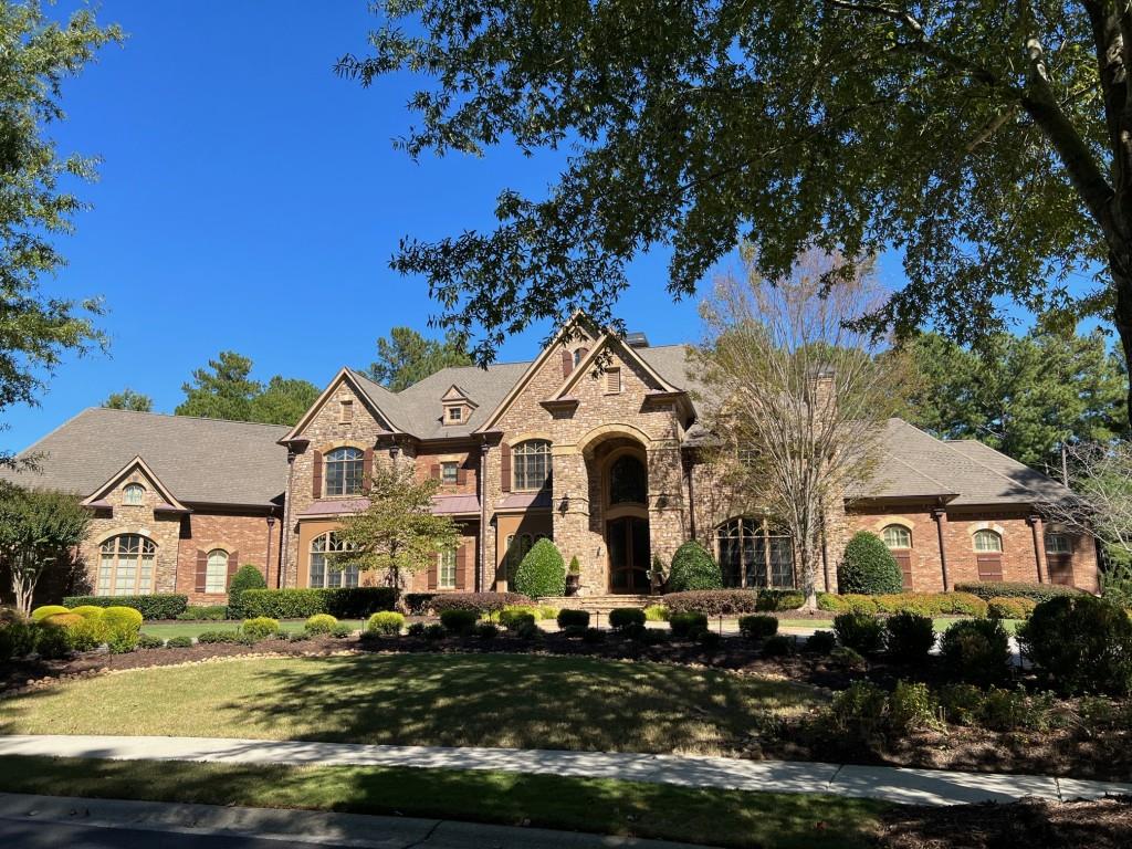 6218 Zell Miller Path Acworth, GA 30101 - Photo 16 of 53 a front view of a house with a garden