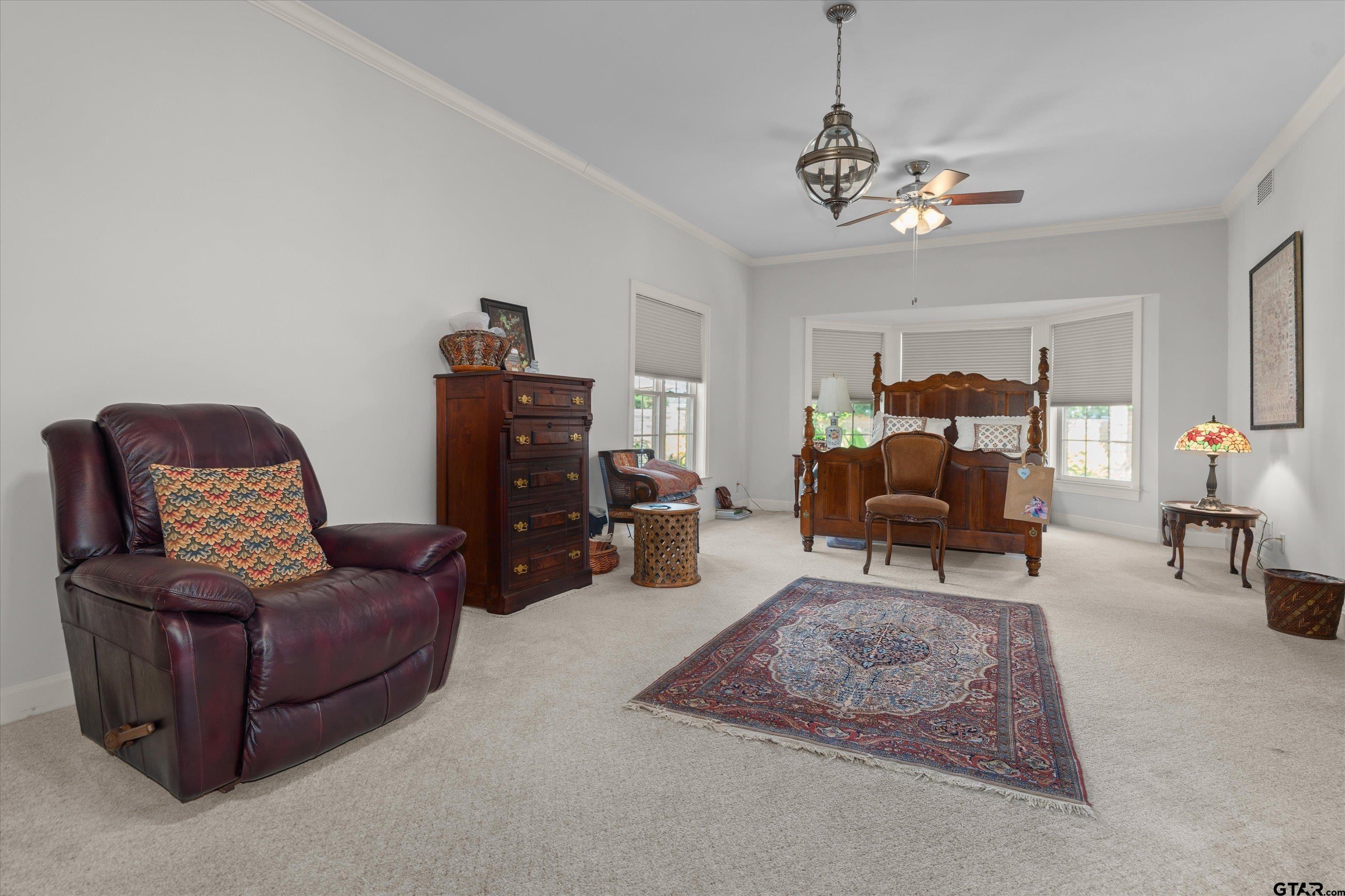 121 Fair Lane Tyler, TX 75701 - Photo 20 of 46 a living room with furniture and a chandelier
