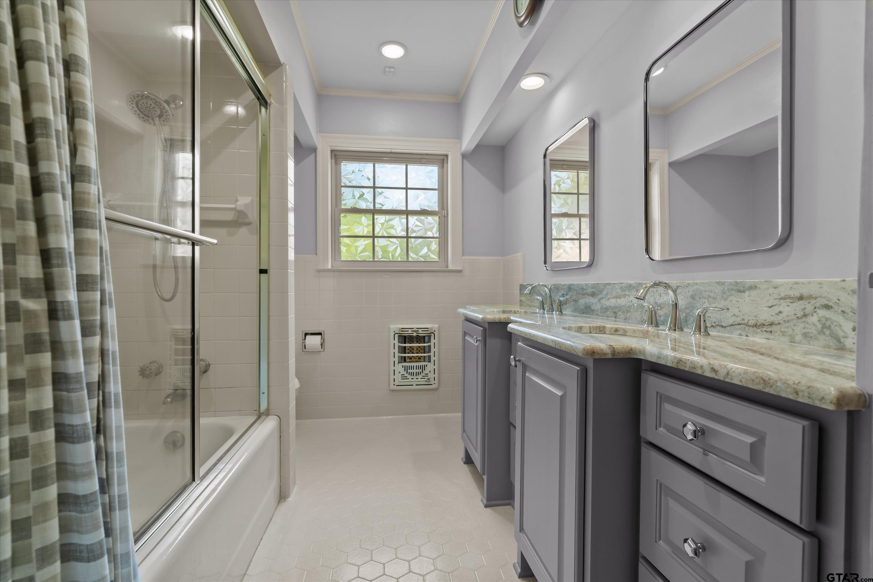 121 Fair Lane Tyler, TX 75701 - Photo 27 of 46 a bathroom with a granite countertop sink mirror and double