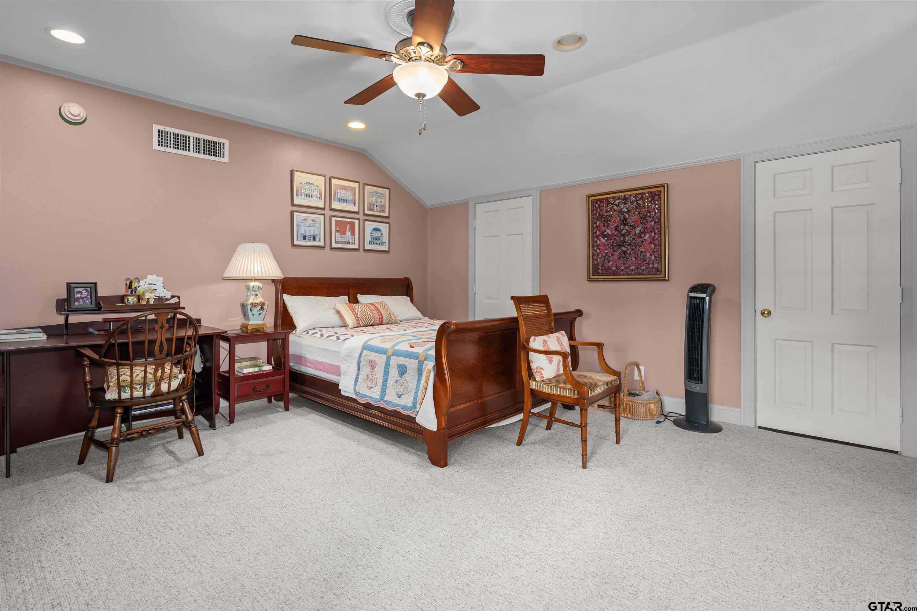 121 Fair Lane Tyler, TX 75701 - Photo 29 of 46 a bedroom with a bed and a table in it