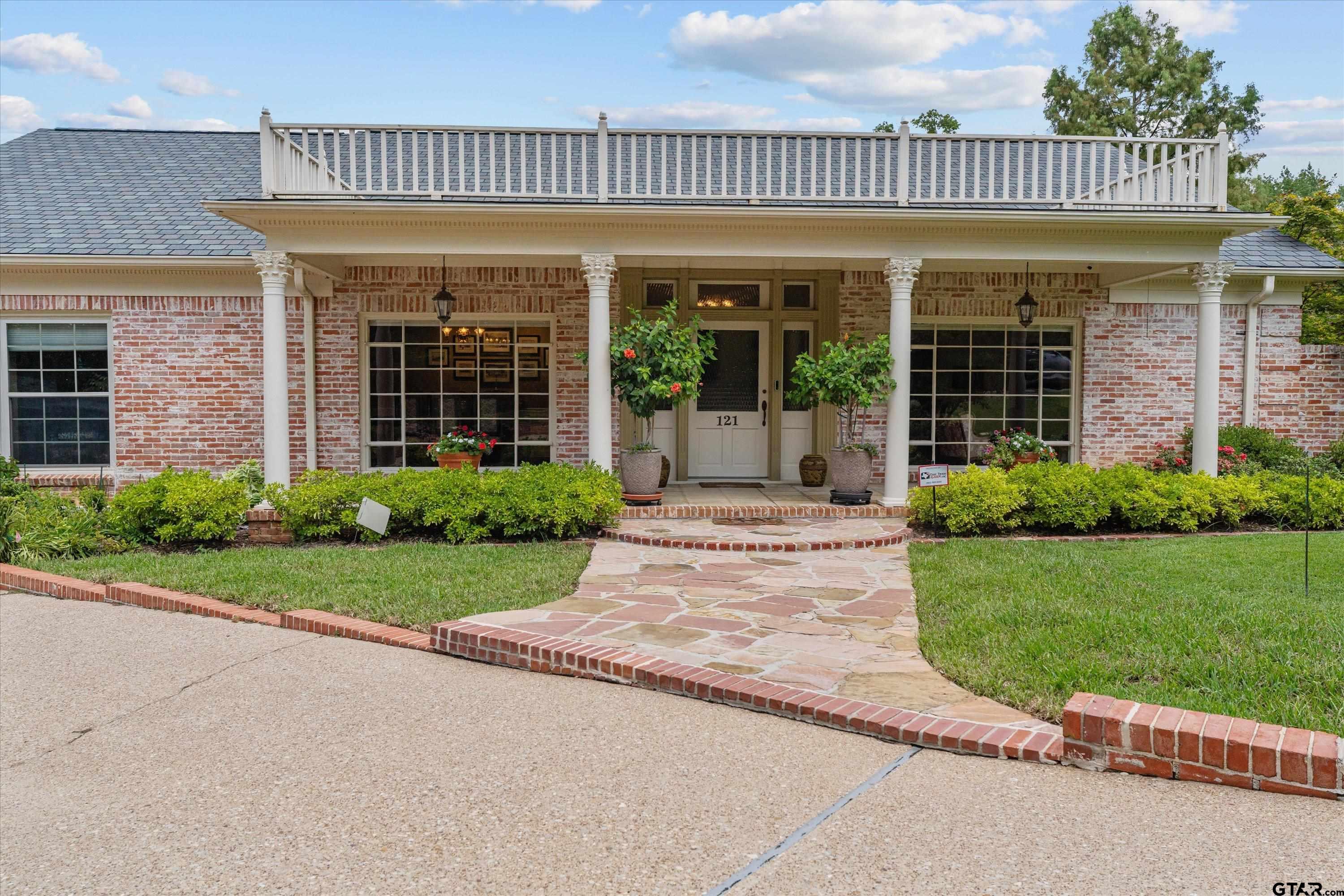 121 Fair Lane Tyler, TX 75701 - Photo 3 of 46 a view of a house with a yard and plants
