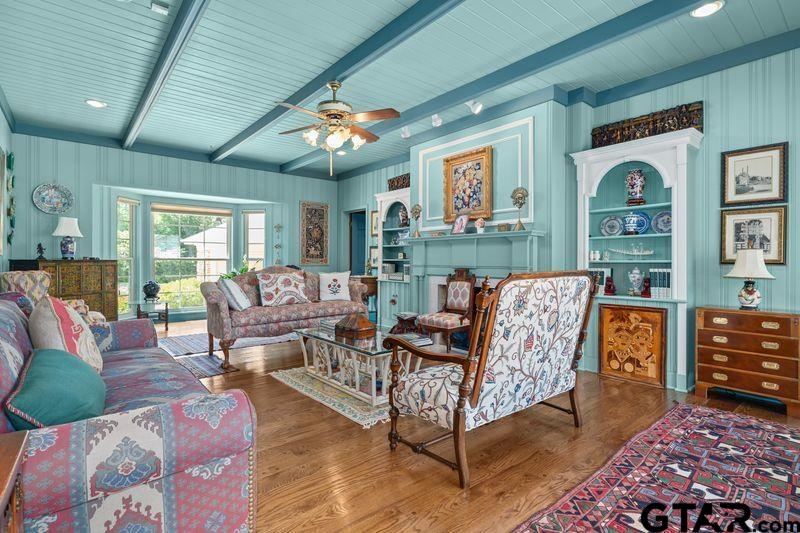 121 Fair Lane Tyler, TX 75701 - Photo 32 of 46 a living room with furniture and wooden floor