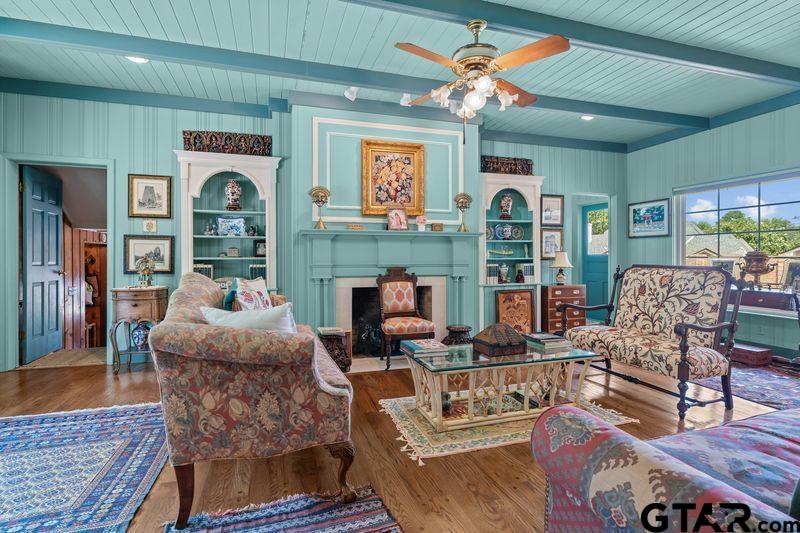 121 Fair Lane Tyler, TX 75701 - Photo 33 of 46 a living room with fireplace furniture and a floor to ceiling window