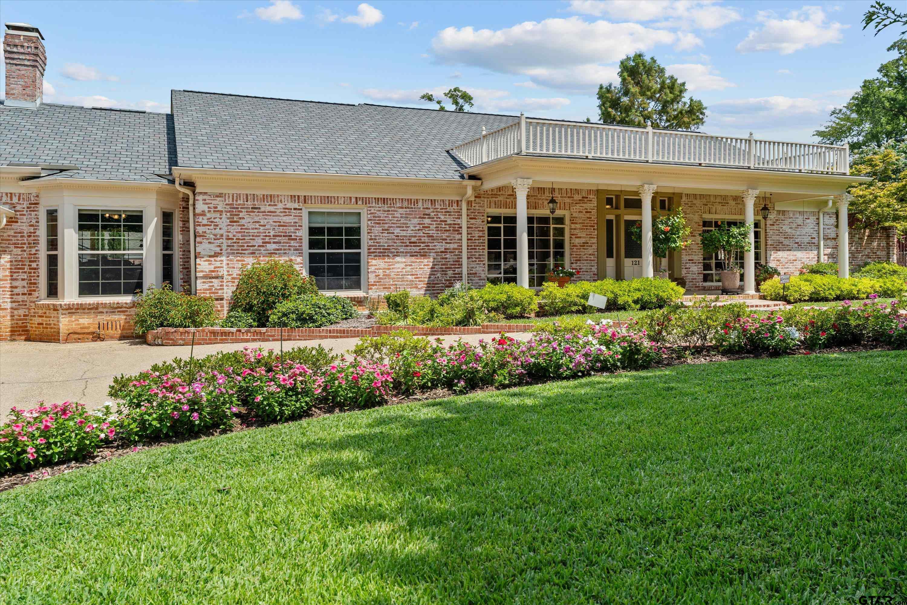 121 Fair Lane Tyler, TX 75701 - Photo 4 of 46 front view of a house with a yard
