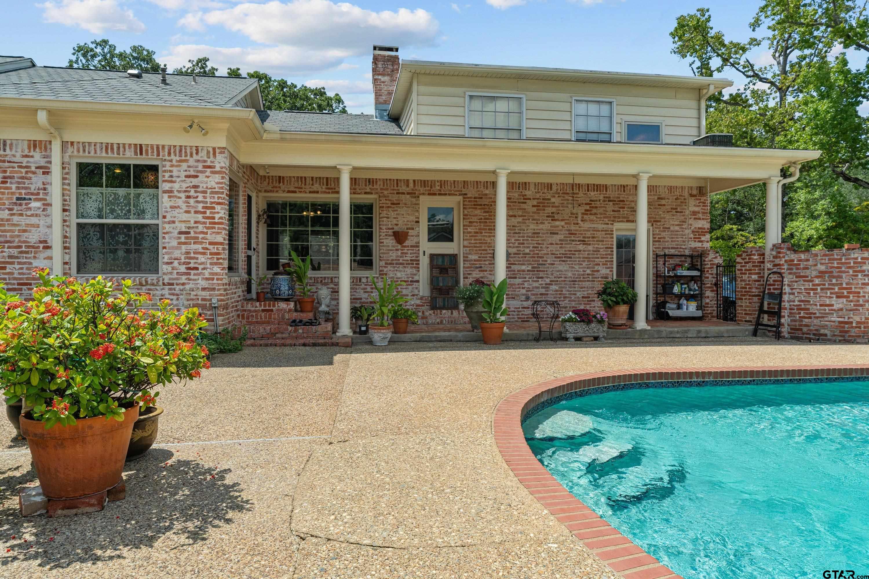 121 Fair Lane Tyler, TX 75701 - Photo 41 of 46 front view of a house with a garden