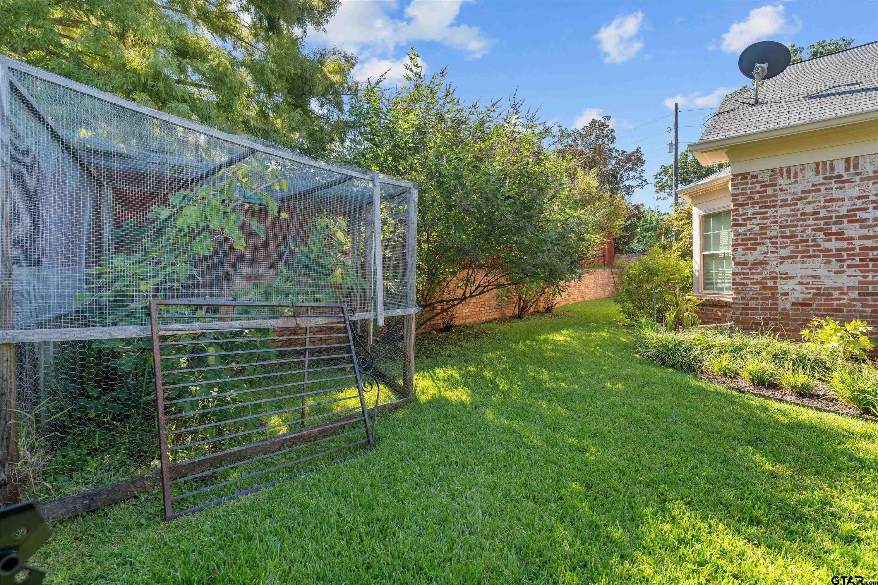 121 Fair Lane Tyler, TX 75701 - Photo 46 of 46 a view of a backyard with plants and a garden