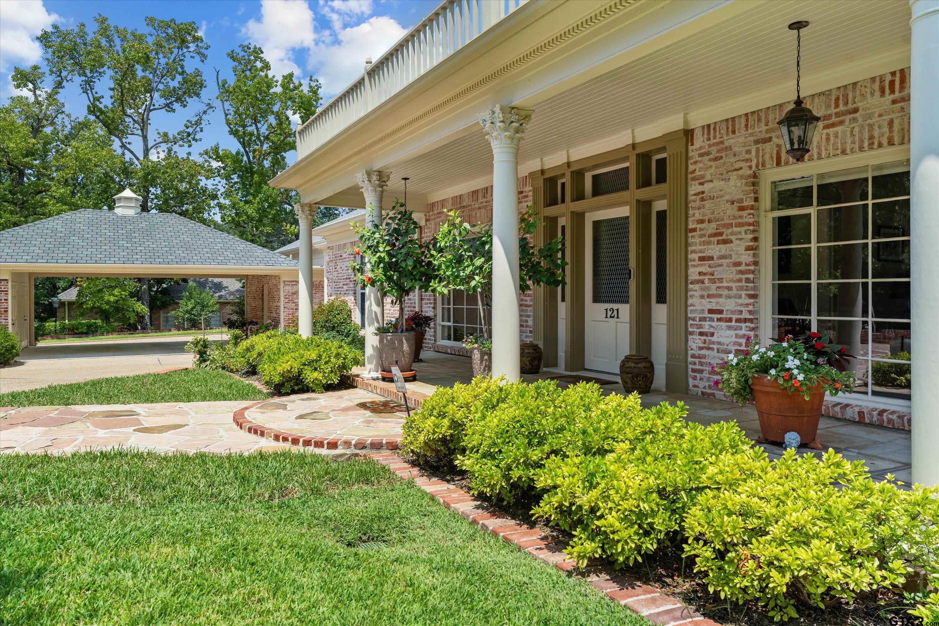 121 Fair Lane Tyler, TX 75701 - Photo 5 of 46 a front view of a house with garden
