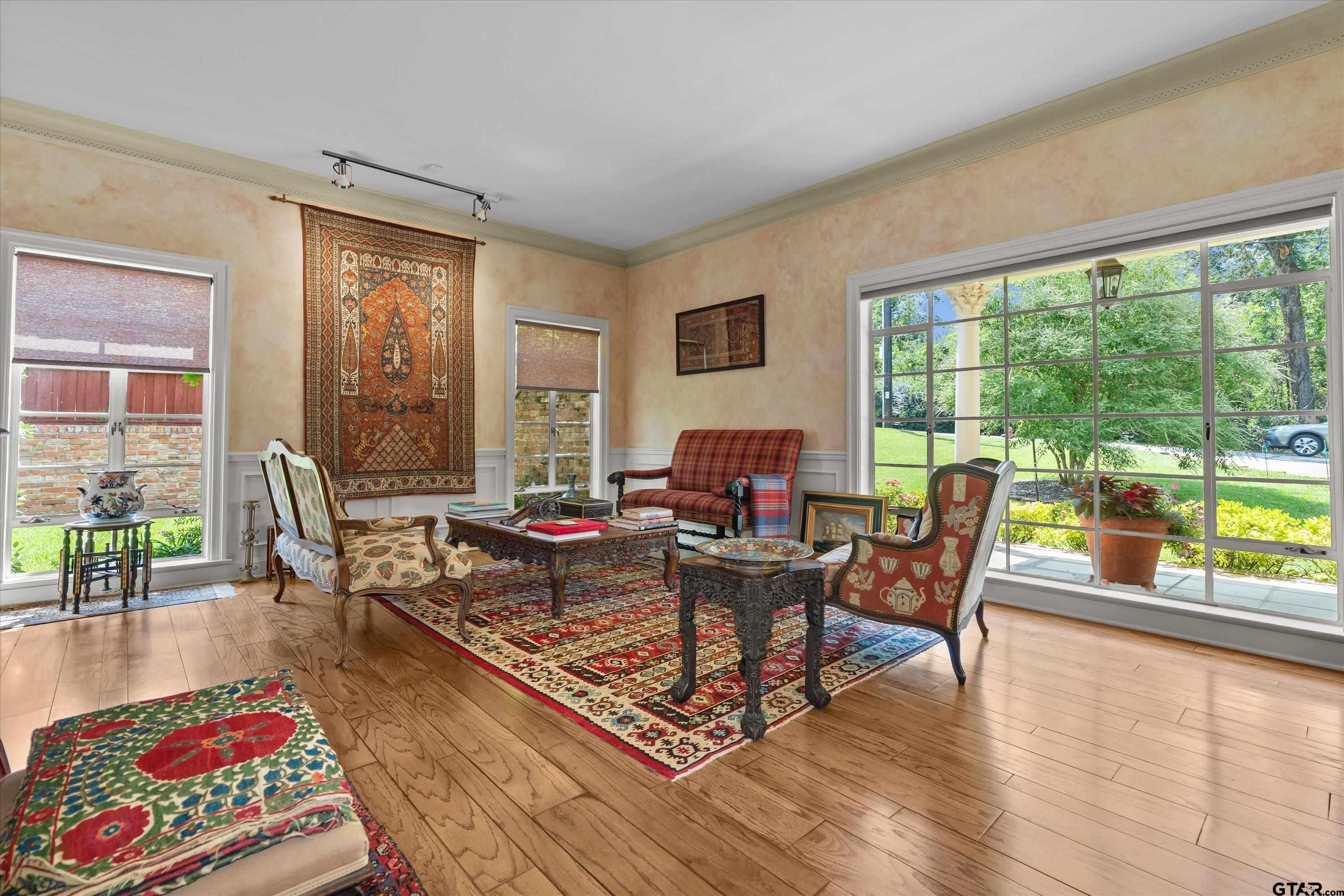 121 Fair Lane Tyler, TX 75701 - Photo 10 of 46 a living room with furniture and a floor to ceiling window