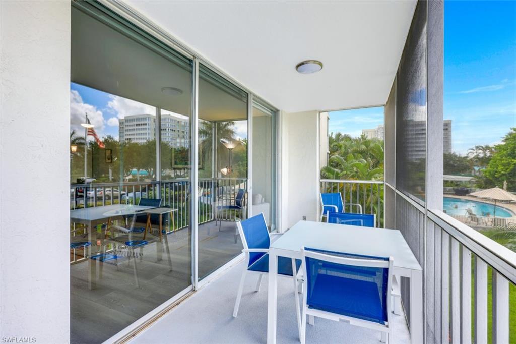 5 Bluebill Avenue, Unit 210 Naples, FL 34108 - Photo 18 of 26 a view of a city from a balcony