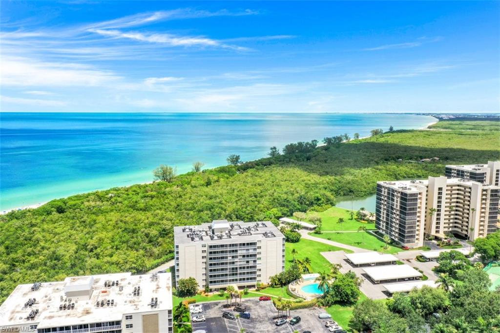 5 Bluebill Avenue, Unit 210 Naples, FL 34108 - Photo 25 of 26 a view of a city with tall buildings