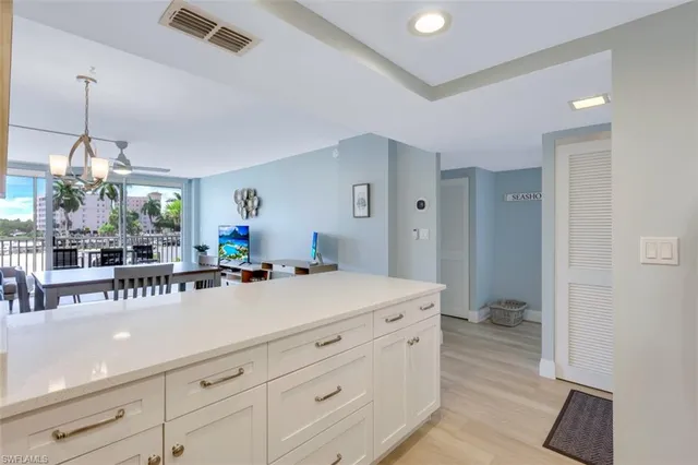 a spacious bathroom with a sink a mirror and a bathtub