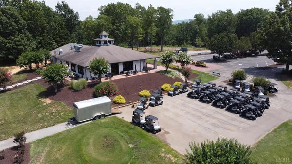 an aerial view of a house with a swimming pool