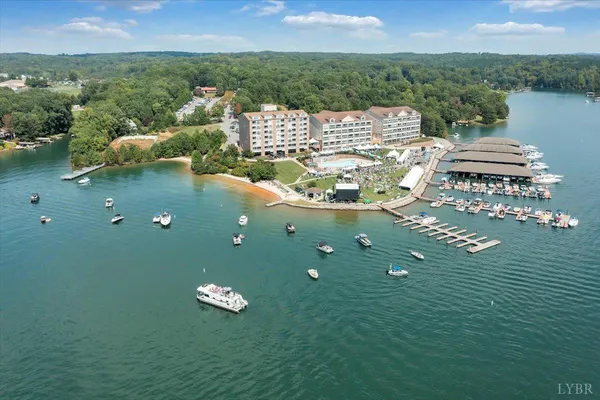 an aerial view of a house with a lake view