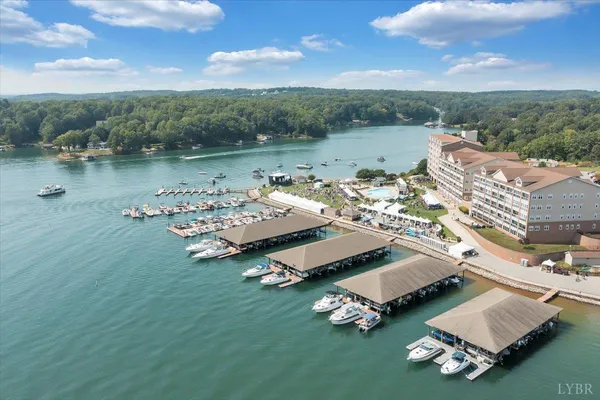 a view of a lake with houses in the back