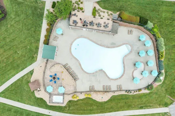 a view of a swimming pool with a table and chairs