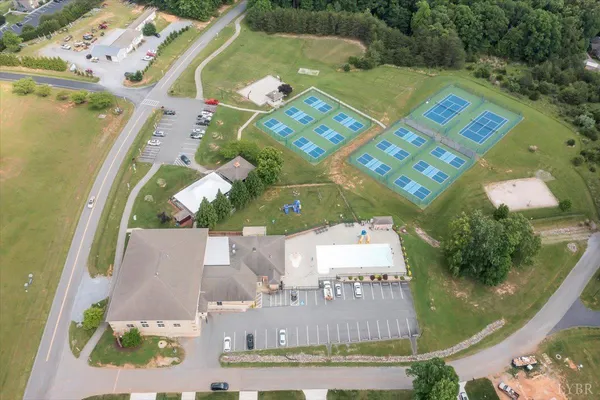 a view of a yard with swimming pool and furniture