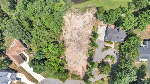 an aerial view of a house with yard and outdoor space